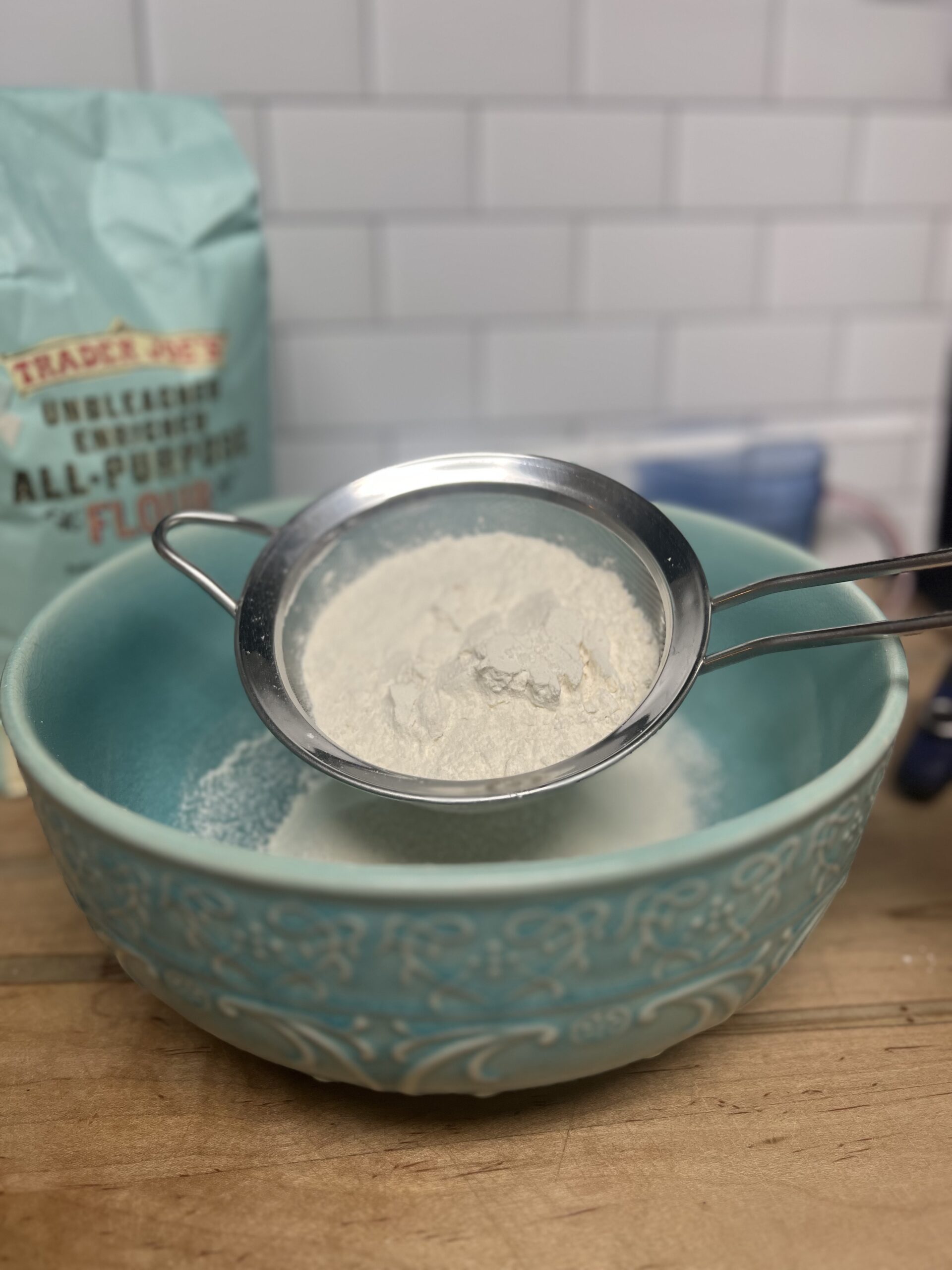 Finely sifting the flour and salt is a key tip for extra fluffy biscuits.